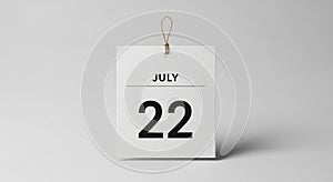 It hangs from a thin string against a plain light gray background