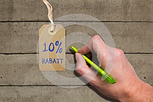 Hangtag with title 10% REBATE in German