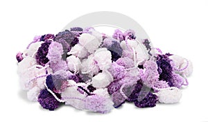 Hanks of white, violet and purple pompons