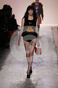 Hannah Elyse walks the runway at the Jeremy Scott show