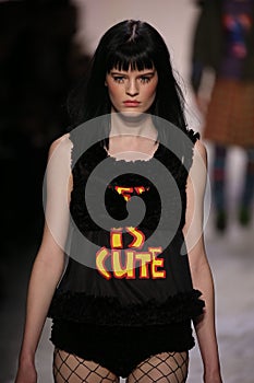 Hannah Elyse walks the runway at the Jeremy Scott show