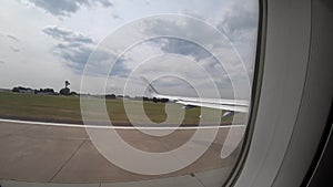 Hannover, Germany - June 16, 2018: Take-off of the plane from the airport of Hanover HAJ , view from passenger window