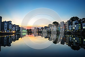 Hanoi cityscape at sunset. Resident buildings by Tien Bien lake, Gia Lam district