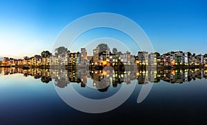 Hanoi cityscape at sunset. Resident buildings by Tien Bien lake, Gia Lam district