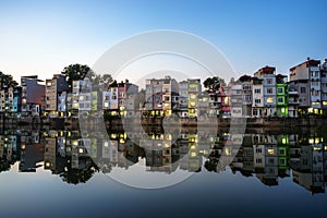 Hanoi cityscape at sunset. Resident buildings by Tien Bien lake, Gia Lam district photo