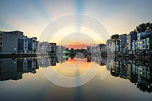 Hanoi cityscape at sunset. Resident buildings by Tien Bien lake, Gia Lam district photo