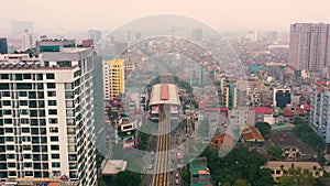 HANOI, VIETNAM - APRIL, 2020: Aerial panorama view of the railroad overpass with station and cityscape of Hanoi.