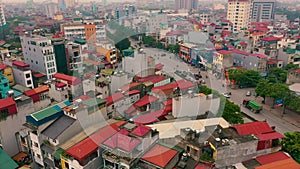 HANOI, VIETNAM - APRIL, 2020: Aerial panorama view of the roofs of houses and crossroad of the city of Hanoi.