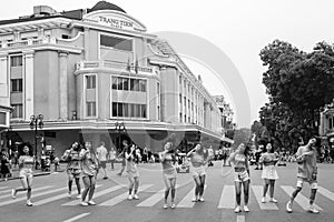 Hanoi, Vietnam - April 13, 2018: Girl group perfomrs in traffic-calmed area of Hanoi.