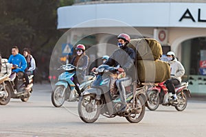 Vietnam, man rides motorbike