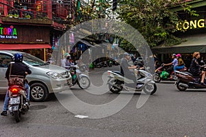 HANOI, VIETNAM, 4 JANUARY 2020: Traffic jam and lots of motorbikes on the roads of the city center