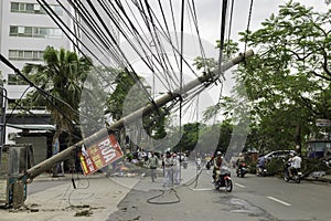 Hanoi, Vietnam - June 14, 2015: Fallen electric pole damaged on street by natural heavy wind storm in Kim Nguu street