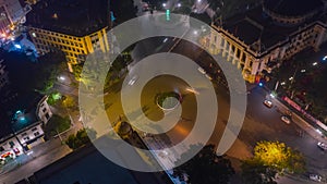 HANOI, VIETNAM - MAY, 2023: Night aerial drone view timelapse of a city streets in downtown nightlife traffic from a top