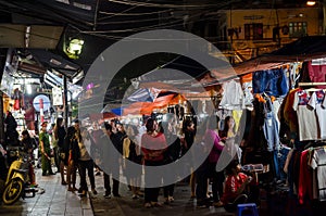 Night street market in Hanoi Old Quarter, people can seen exploring around it.