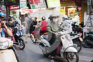 Hanoi, Vietnam - NOVEMBER 28 2019: Traffic mainly made of motorcycles in the center of Hanoi