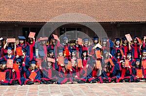 Vietnamese students taking graduation photo at the Temple of Literature, it also known as Temple of Confucius in Hanoi.