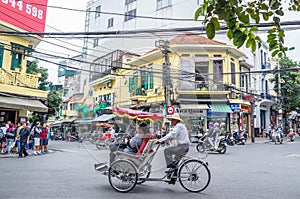 View of busy traffic with motorbikes and vehicles in Hanoi Old Quarter, capital of Vietnam.