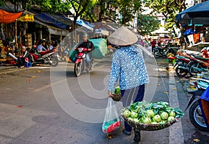 Local vendors selling food at Old Quarter morning market in Hanoi