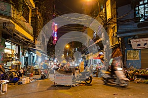 Night street market in Hanoi Old Quarter, people can seen exploring around it.