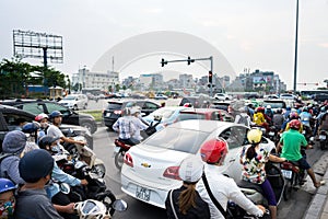 Hanoi, Vietnam - Sep 4, 2016: Cars and motorcycles stuck at traffic jam, rush hour in Co Linh street, Long Bien district
