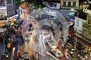 Hanoi, Vietnam : Sep 09 2017 : Pedestrians on road with traffic jam in old quarter town in rainy