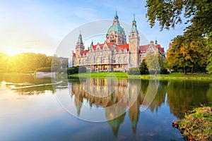 New Town Hall reflecting in water in Hanover, Germany photo