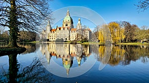 Hanover Maschpark new town hall with beautiful tree reflection in the lake water