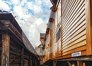 Hanseatic commercial wooden buildings on each side of passageway Bryggen Bergen Norway UNESCO world Heritage Site
