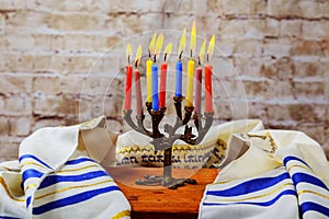 Hanuka menorah with burning candles.