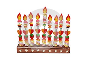 Hanukah menorah made from candies with paper flame