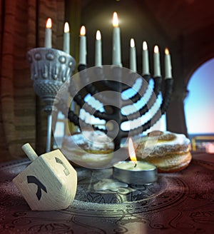 Hanukkah background with candles, donuts, spinning top