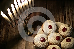 Hanukkah candle on wooden background