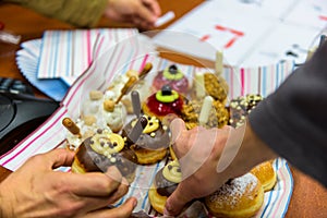 Hanukkah celebration with various decorated donuts