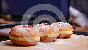 Hanukkah food doughnuts with jelly and sugar powder okeh background. Jewish holiday Hanukkah concept and background.y