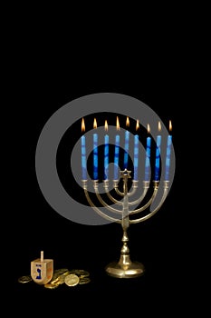 Hanukkah Menorah with a Dreidel and Gelt photo