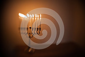 Hanukkah menorah, or hanukkiah in the light of the sun at sunset for Jewish holiday Hanukkah.