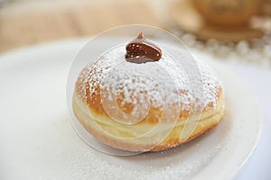 Hanukkah symbol jewish food holiday image of donut with caramel, sugar powder and cup cafe