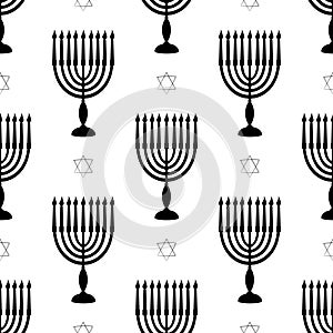 Hanukkah symbols menorah with candles star of david seamless pattern. Black silhouette background for Jewish festival of photo