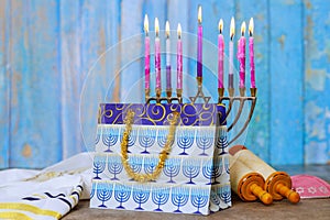 With Hanukkiah menorah burning candles, Hanukkah is a traditional religious symbol of Jewish holiday Hanukkah