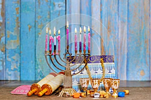 Hanukkiah Menorah with candles burning is a traditional symbol of Jewish faith during holiday Hanukkah