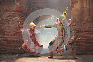 Hanuman monkey god fighting Thotsakan giant in Khon or Traditional Thai Pantomime as a cultural dancing arts performance