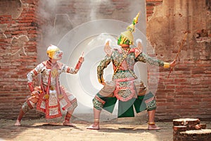 Hanuman monkey god fighting Thotsakan giant in Khon or Traditional Thai Pantomime as a cultural dancing arts performance photo