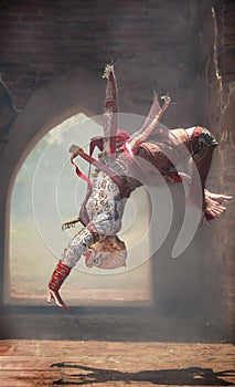 Hanuman monkey god somersaults in Khon or Traditional Thai Pantomime as a cultural dancing arts performance in masks dressed