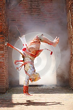 Hanuman monkey god somersaults in Khon or Traditional Thai Pantomime as a cultural dancing arts performance in masks dressed bas