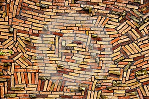 Haphazardly stacked brick wall photo