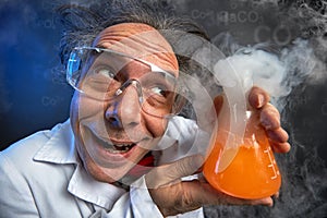 Happily crazy chemist with his experiment