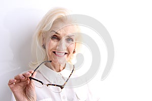 Happily laughing old female person