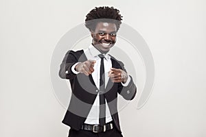 Happiness african man pointing fingers at camera.