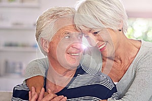 Happiness is being close to you. a happy senior couple at home.