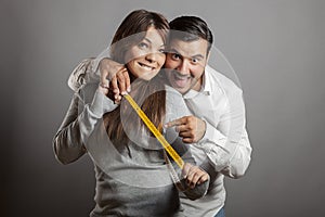 Happiness and boldness couple showing off sex length